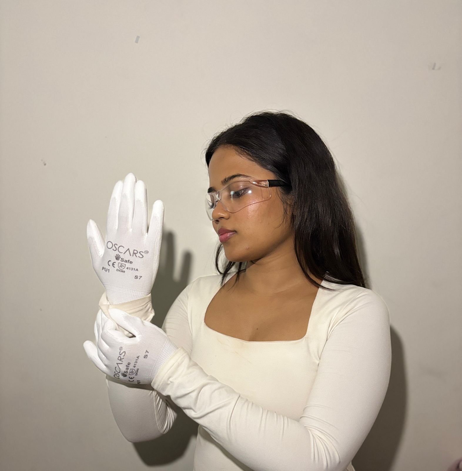 Oscars white glove palm branding detail
